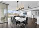 Spacious open-concept living area with large windows showcasing the cityscape, seamlessly blending dining and relaxation spaces at 260 S Osceola Ave # 1406, Orlando, FL 32801