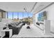 Bright living area with floor-to-ceiling windows, a plush rug, modern furnishings, and expansive city views at 260 S Osceola Ave # 1406, Orlando, FL 32801