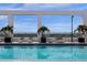 Rooftop pool featuring sun loungers and vibrant blue water at 260 S Osceola Ave # 1406, Orlando, FL 32801