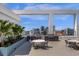Rooftop social area including outside seating, grills, and city views at 260 S Osceola Ave # 1406, Orlando, FL 32801