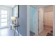 Bathroom with a shower featuring a patterned curtain at 2924 Protagonist St, Kissimmee, FL 34746