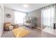 Bright bedroom featuring a bunk bed, modern chair, and a yellow rug at 2924 Protagonist St, Kissimmee, FL 34746