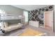 This bedroom features bunk beds, neutral walls, and a playful record display on the accent wall at 2924 Protagonist St, Kissimmee, FL 34746