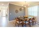Dining room featuring a glass table, six chairs and light fixture at 2924 Protagonist St, Kissimmee, FL 34746
