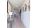 Inviting hallway with stylish decor leads to the staircase and living area at 2924 Protagonist St, Kissimmee, FL 34746