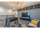 Stylish living area with foosball table, TV, and unique lighting, creating a fun and inviting space at 2924 Protagonist St, Kissimmee, FL 34746