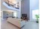 Open-concept living room and dining area with modern furnishings and high ceilings at 2924 Protagonist St, Kissimmee, FL 34746