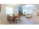 Bright, open-concept living and dining area with modern lighting and large windows at 2924 Protagonist St, Kissimmee, FL 34746