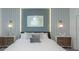 This cozy main bedroom features attractive side tables with matching lamps and a decorative paneled headboard at 2924 Protagonist St, Kissimmee, FL 34746