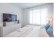 Bright main bedroom with luxurious bedding, modern decor, and ample natural light at 2924 Protagonist St, Kissimmee, FL 34746