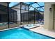 This property features a screened-in pool and hot tub, perfect for enjoying the outdoors in privacy at 2924 Protagonist St, Kissimmee, FL 34746