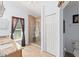 Bathroom with a large glass enclosed shower, a window, and granite countertop at 30108 Pga Dr, Sorrento, FL 32776