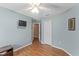 Bedroom with wood flooring and a ceiling fan at 30108 Pga Dr, Sorrento, FL 32776
