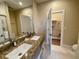 Bathroom features a double vanity with a walk-in closet at 3235 Brasilia Ave, Kissimmee, FL 34747