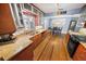 Well-lit kitchen with granite counters, stainless steel appliances, and hardwood floors at 328 E Minnehaha Ave, Clermont, FL 34711