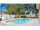 Relax in this backyard oasis with a sparkling pool and lush landscaping for privacy at 328 E Minnehaha Ave, Clermont, FL 34711
