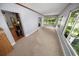 Bright sun room with multiple windows, providing natural light and views of the surrounding greenery at 328 E Minnehaha Ave, Clermont, FL 34711