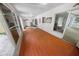 Spacious sun room with hardwood floors and ample natural light creating a warm atmosphere at 328 E Minnehaha Ave, Clermont, FL 34711