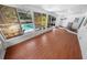 Bright sun room with views of the pool and ample natural light for relaxing and entertaining at 328 E Minnehaha Ave, Clermont, FL 34711