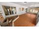 Inviting sun room with a beautiful water feature and views of the kitchen at 328 E Minnehaha Ave, Clermont, FL 34711