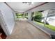 Relaxing sunroom with large picture windows providing abundant natural light and green views at 328 E Minnehaha Ave, Clermont, FL 34711