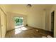 Bedroom with wood flooring, white walls and a sliding glass door at 39 S College Ave, Maitland, FL 32751