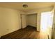 Bedroom with wood flooring, white walls, and a closet at 39 S College Ave, Maitland, FL 32751
