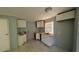 Small kitchen featuring new cabinets and updated countertop with tiling at 39 S College Ave, Maitland, FL 32751