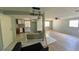 Open concept living area with hardwood floors connecting the kitchen and living space at 39 S College Ave, Maitland, FL 32751