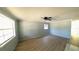 Bright living room with wood-look floors, a ceiling fan and natural light at 39 S College Ave, Maitland, FL 32751