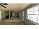 Bright, open living area flowing into the kitchen area with mixed flooring at 39 S College Ave, Maitland, FL 32751
