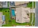 An aerial view of the home shows the roofline and the screen-enclosed pool and spa at 3926 Ventura Place, Orlando, FL 32822