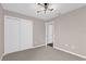 Neutral bedroom featuring a chandelier, closet, carpeted floors, and light-colored walls at 3926 Ventura Place, Orlando, FL 32822