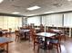 Elegant clubhouse space with cozy seating, bookshelves and tables for residents to relax and mingle at 3926 Ventura Place, Orlando, FL 32822