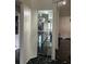 Hallway featuring a built-in mirrored display shelf at 3926 Ventura Place, Orlando, FL 32822