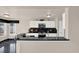 Modern kitchen featuring white cabinets, black countertops, and stainless steel appliances at 3926 Ventura Place, Orlando, FL 32822