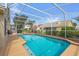 Screen-enclosed pool with spacious deck and lush landscaping at 3926 Ventura Place, Orlando, FL 32822
