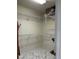 Walk-in closet with white wire racks and shelving with marble-tiled floors at 3926 Ventura Place, Orlando, FL 32822