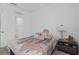Inviting bedroom with soft lighting, and a stylishly decorated nightstand at 4223 Little Owl Ln, Kissimmee, FL 34746