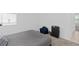 Carpeted bedroom featuring a cozy full-sized bed with neutral decor and ample natural light at 4223 Little Owl Ln, Kissimmee, FL 34746