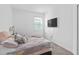 Bright bedroom with neutral colors, carpet flooring, a TV, and lots of natural light at 4223 Little Owl Ln, Kissimmee, FL 34746