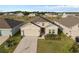Elevated view of a well-manicured home with a two-car garage in a friendly neighborhood at 4223 Little Owl Ln, Kissimmee, FL 34746