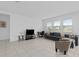 Comfortable living room with large windows and a neutral color scheme, perfect for relaxation at 4223 Little Owl Ln, Kissimmee, FL 34746