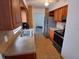 Functional kitchen featuring wood cabinetry and modern stainless steel appliances at 4225 Ne 25Th Ave, Ocala, FL 34479
