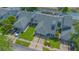 An aerial view displays townhomes with green roofs and well-maintained lawns at 4545 Southfield Ave, Orlando, FL 32812