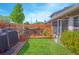 Outdoor wooden deck with seating, grill, and decorative plants offer a relaxing backyard retreat at 4545 Southfield Ave, Orlando, FL 32812