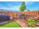 Outdoor wooden deck with seating, grill, and decorative plants offer a relaxing backyard retreat at 4545 Southfield Ave, Orlando, FL 32812