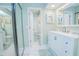 Bright bathroom with a white vanity, modern fixtures, and a large mirror at 4545 Southfield Ave, Orlando, FL 32812