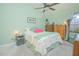 Comfortable bedroom featuring a ceiling fan and dressers at 4545 Southfield Ave, Orlando, FL 32812