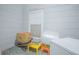 Exterior wall with window, storage box, and various household items at 4545 Southfield Ave, Orlando, FL 32812